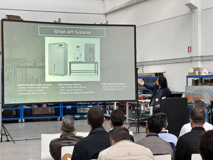 Orion AM CEO Adam Rumjahn presenting Orion's portfolio of industrial 3d printers for automotive and industry at MakeAdditive's Open House 2026 in Bologna.