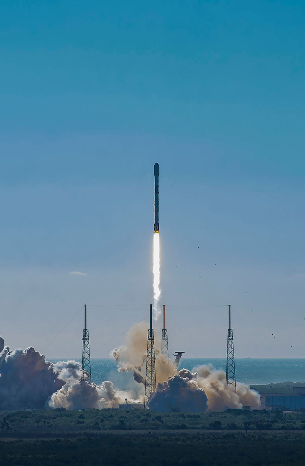 Launch of a rocket carrying small satellites, demonstrating the increasing need for efficient solar panels.